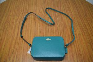 A small blue purse from the 2022 Power of the Purse auction items