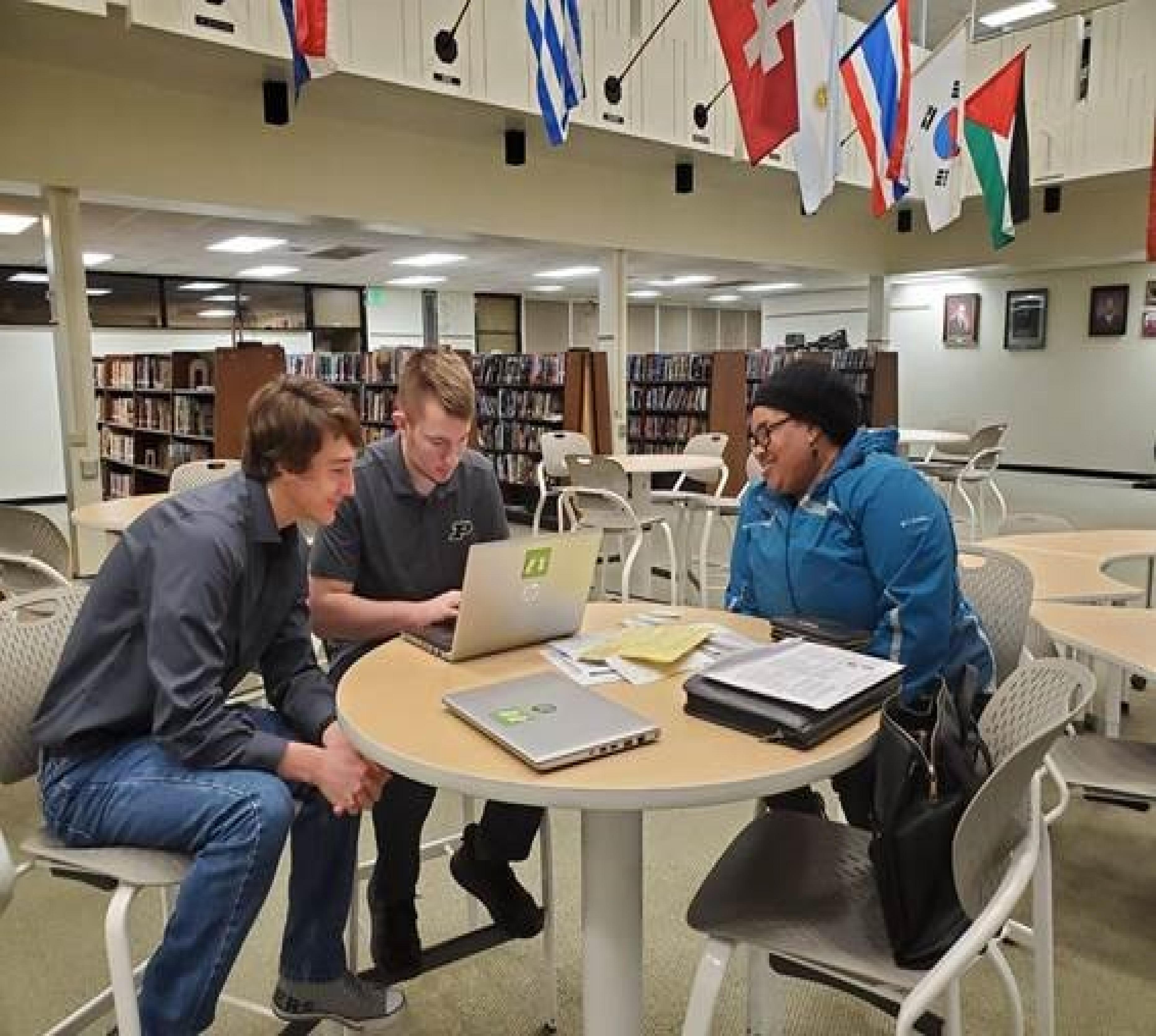 Two Case High School students preparing a tax return for a client.