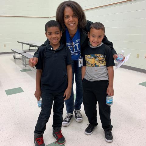 SOH tutor celebrating the end of the school year with their students