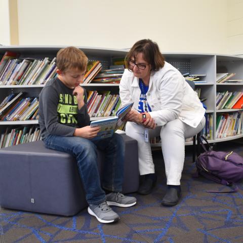 Schools of Hope tutor reads with student