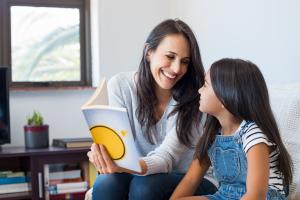 A person reading to a young child